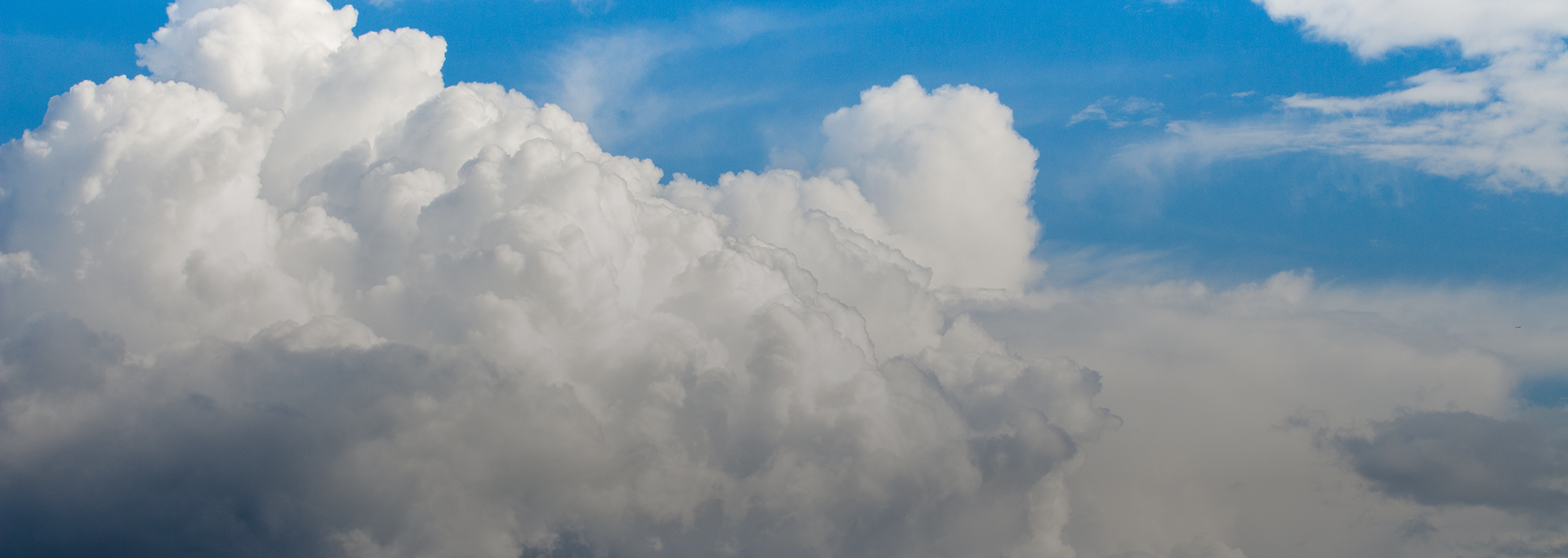 A photo of large, billowing clouds taken from the air